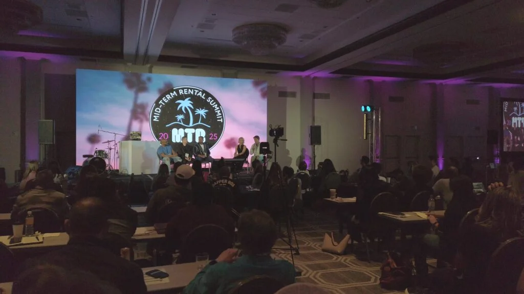 LED wall on stage at the Mid-Term Rental Summit 2025 in San Diego