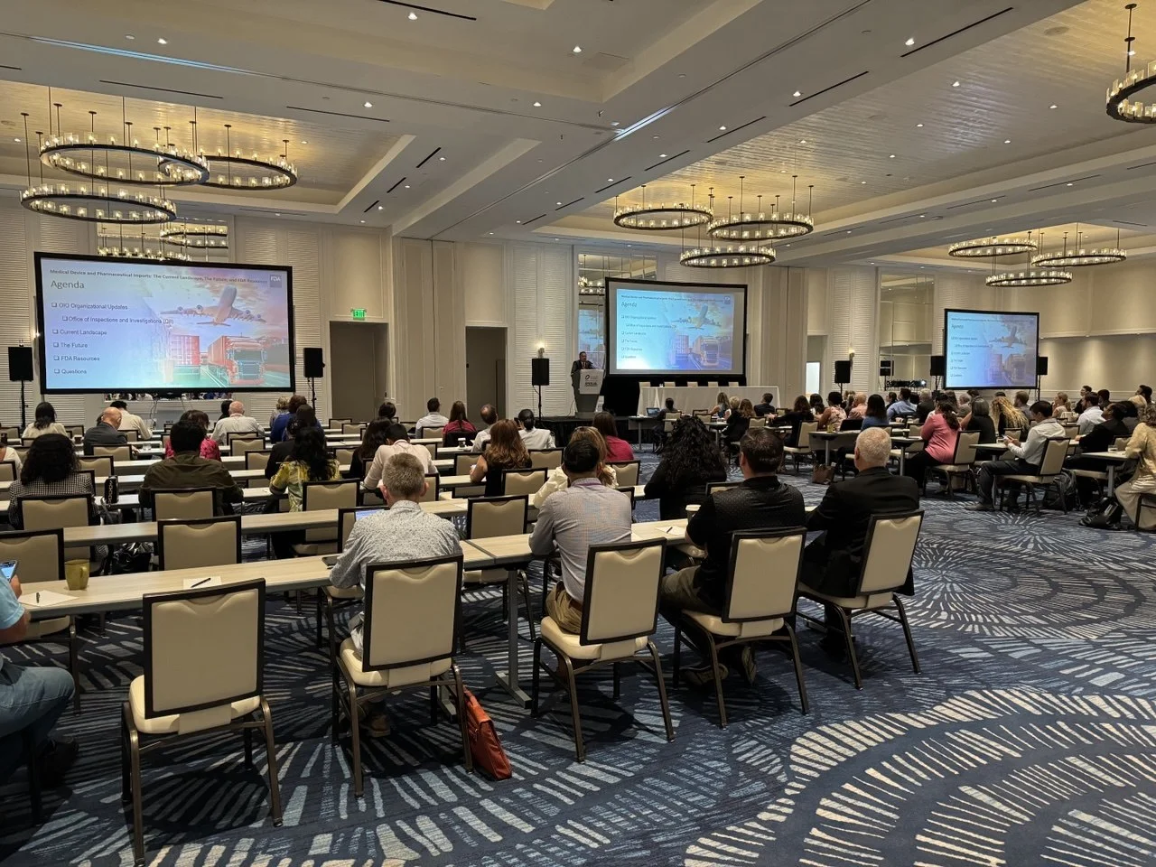 Projection screens across a ballroom for the OCRA conference at the Waterfront Beach Resort in Huntington Beach