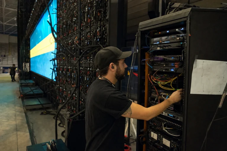 Technician working on an equipment rack