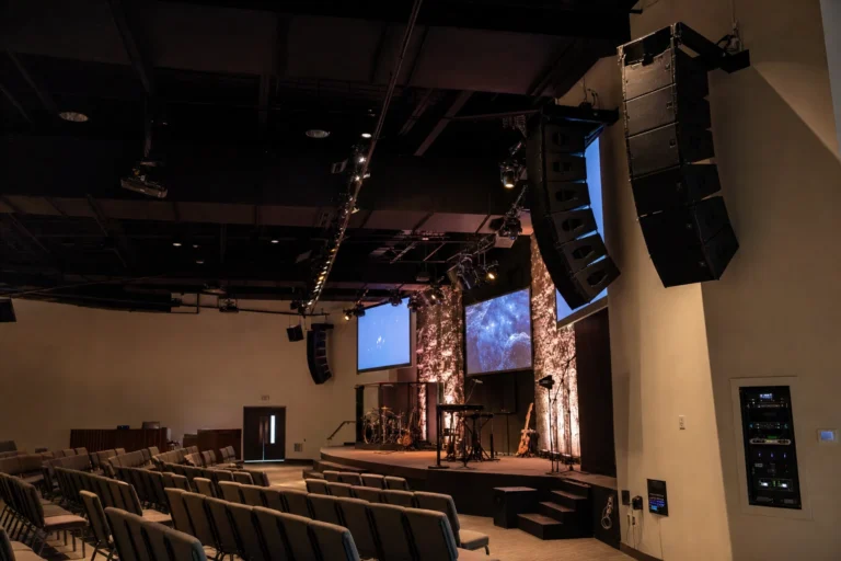 Church stage with speakers and video displays
